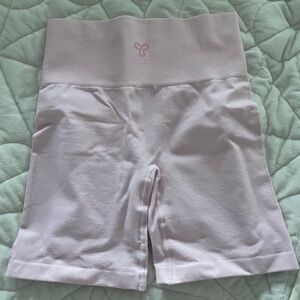 Aritzia TNA biker shorts in pink